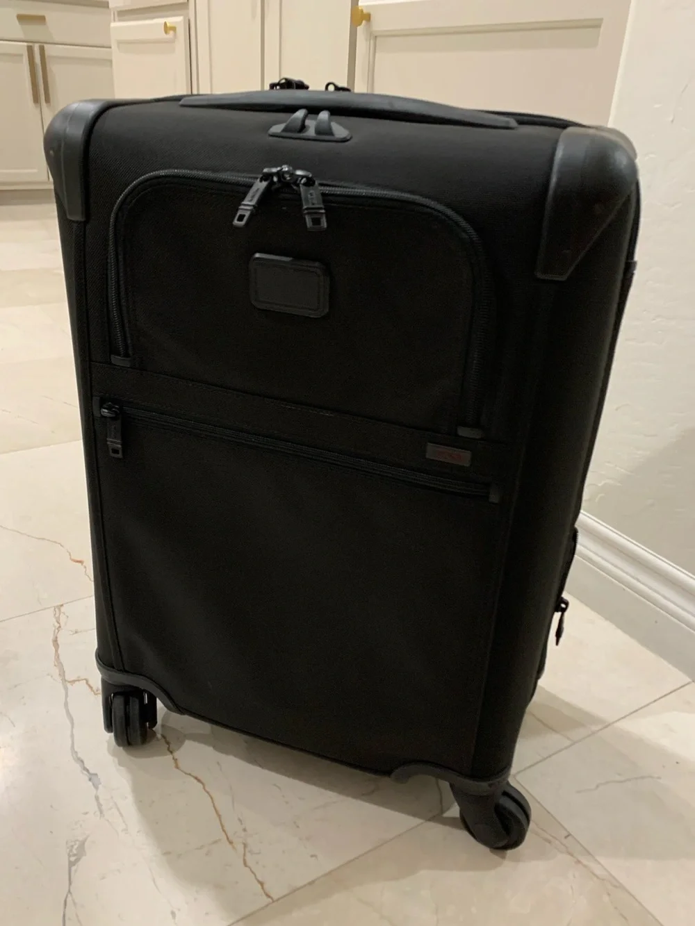 Tumi Black Spinner Carry-On with Front Zip Pocket luggage
